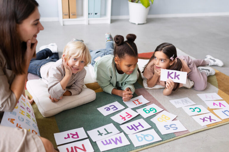elementary teacher utilizes phonics card game to teach diverse young readers