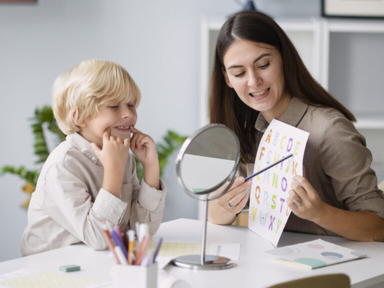 literacy teacher helping young reader sound out letters with phonics
