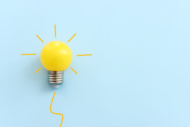 Graphical image of a light bulb over a blue background.