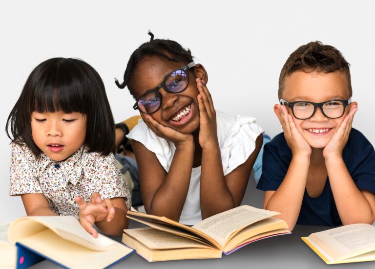 diverse young readers smile while reading