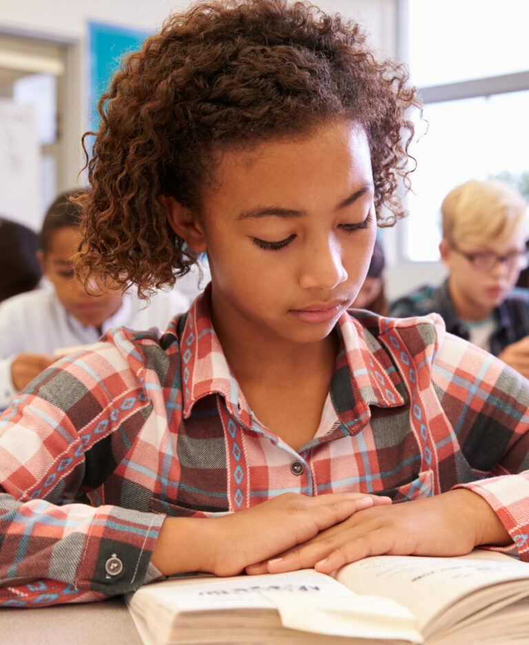 Middle school girl reading a longer chapter book