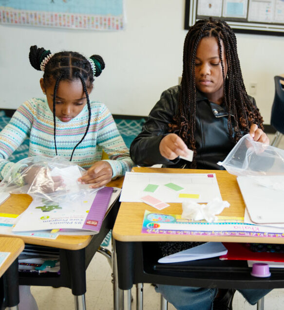 Middle school students holding phonics chips