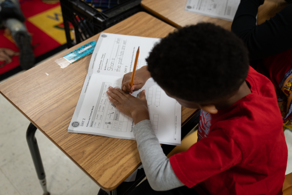 A student works in his phonics book