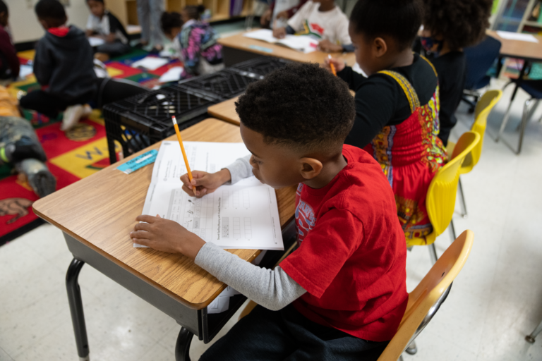 Elementary school students busy with science of reading-based phonics lessons