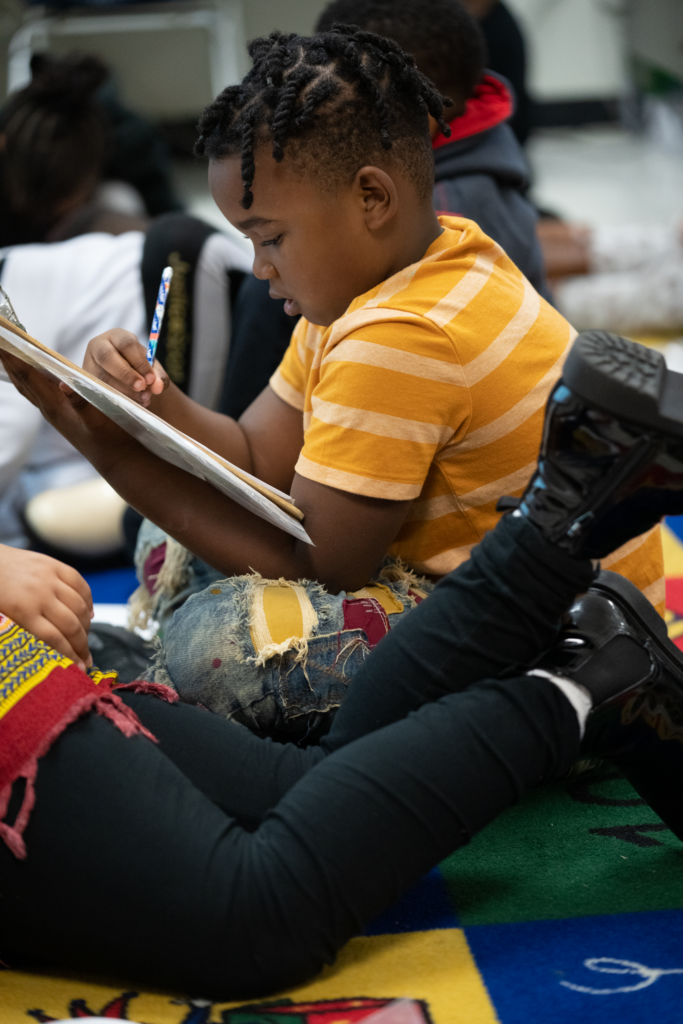 An older elementary school student reinforces his phonics skills