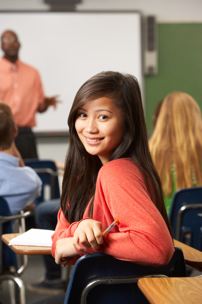 A middle school reader looking proud