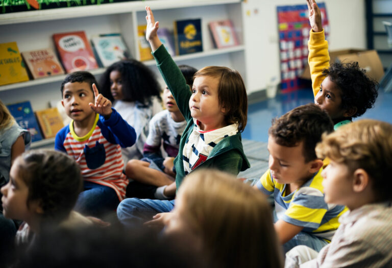 Elementary school students engaged in reading hour