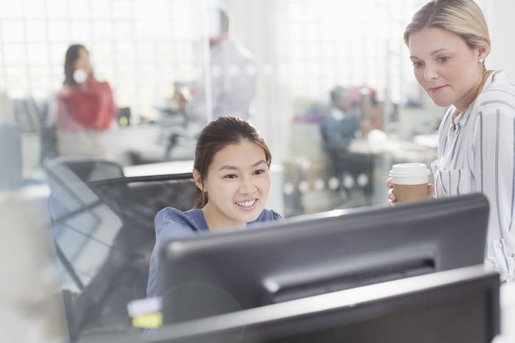 Literacy teacher guides a high school student through digital reading tools