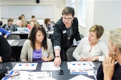 A professional learning instructor mentors teachers and reading specialists in using phonics chips and science-based manipulatives