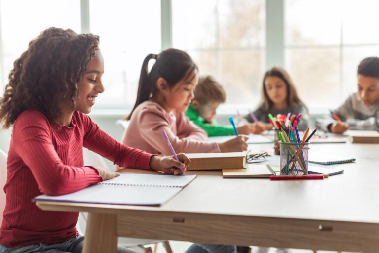 elementary students writing in class