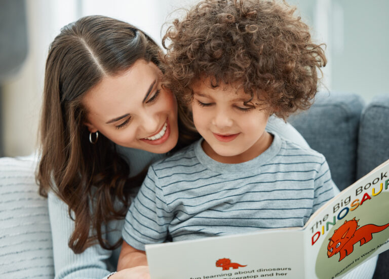 young mother reading to her son