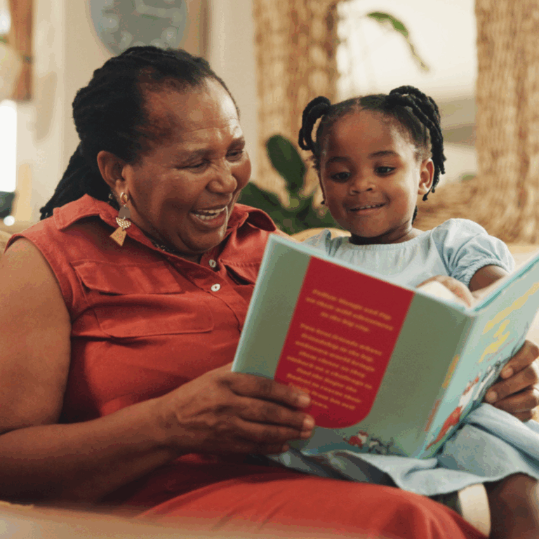 Grandmother, child and reading book for education with smile, learning literature and fantasy storytelling