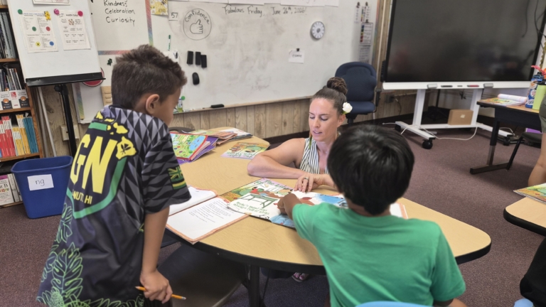 Teacher working with students at the Kapaa-Kaua’i-Waimea Complex Area Schools